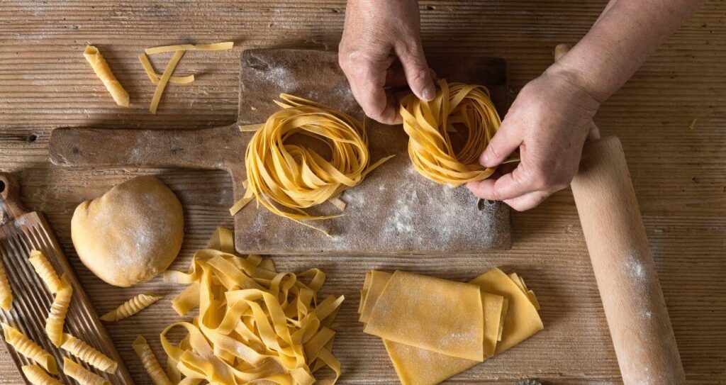 Guests watching pasta being handmade at Philippe’s workshop during the Organic Pasta in Gourville experience, near La Grue Gîtes